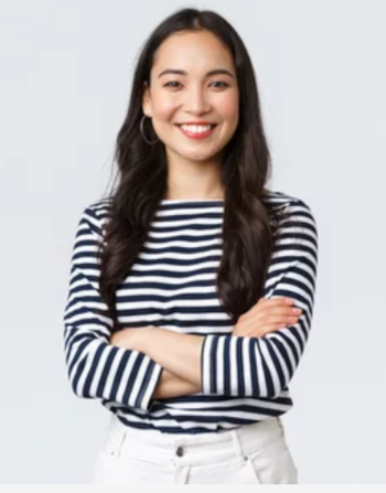 Woman with confident posture, arms crossed, smiling