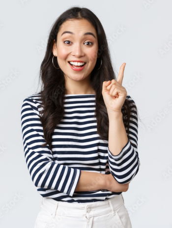 Woman Smiling pointing one finger in air